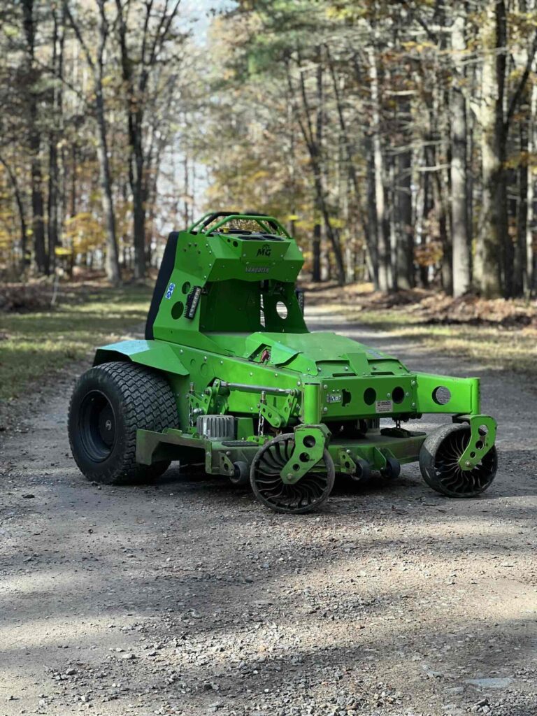 Electric lawn mower at residential landscaping property in Durham NH