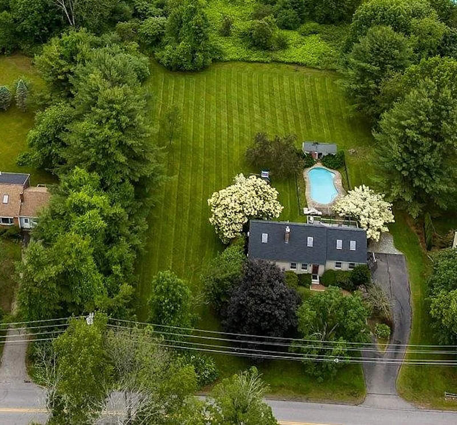 Electric Lawn Mowing – Stratham NH Electric lawn mowing service cutting residential lawn in Stratham NH