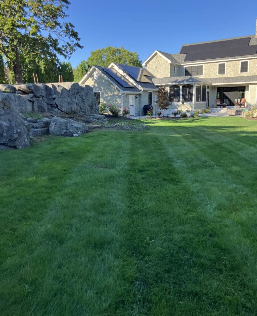 Striped residential lawn after professional mowing service in New Castle NH