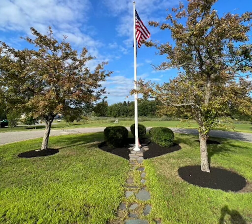 Fresh mulch installation in landscape beds in Newington NH