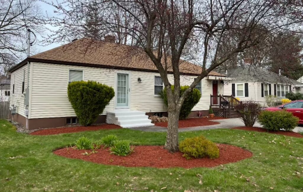 Landscape mulch installation in garden beds at Portsmouth NH home