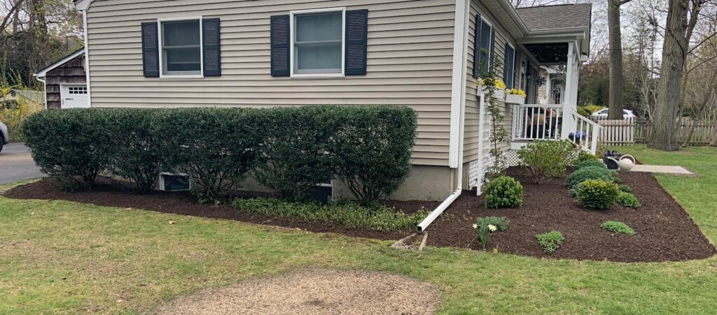 Fresh landscape mulch installation in Portsmouth NH garden beds